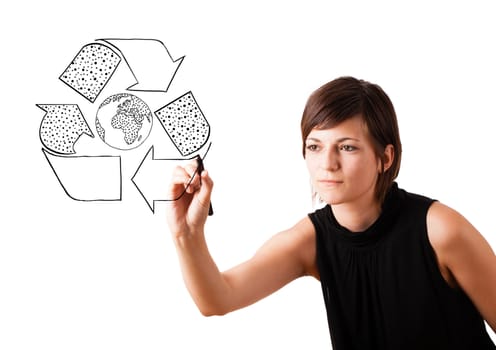 Young woman drawing recycle globe on whiteboard isolated on white