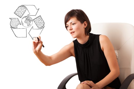 Young woman drawing recycle globe on whiteboard isolated on white
