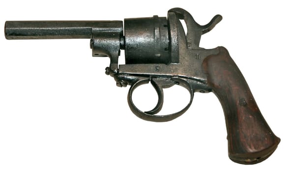 isolated rusty obsolete vintage firearm revolver white background