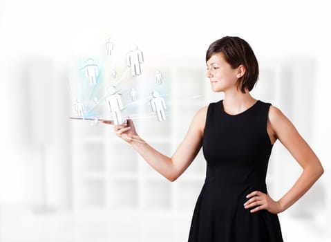 Young business woman looking at modern tablet with social icons