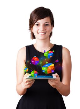Young business woman looking at modern tablet with colourful pie charts