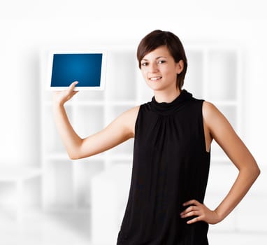 Young business woman looking at modern tablet