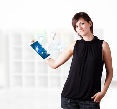 Young business woman looking at modern tablet with social icons