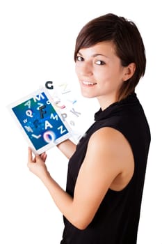 Young business woman looking at modern tablet with alphabet