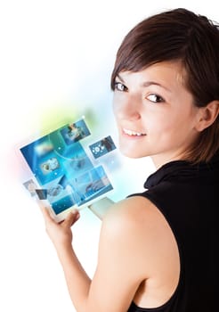 Young business woman browsing pictures on modern tablet