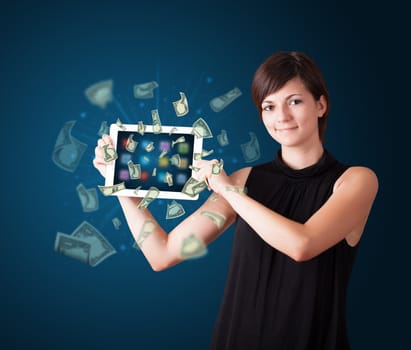 beautiful young woman holding tablet with money