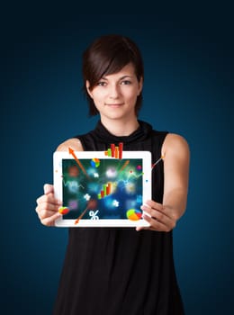 beutiful woman holding modern tablet with colorful diagrams and graphs