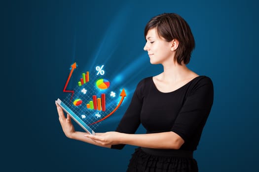 Young business woman looking at modern tablet with abstract lights and various diagrams