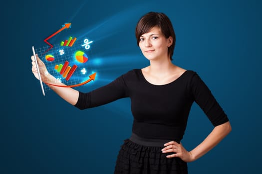 Young business woman looking at modern tablet with abstract lights and various diagrams