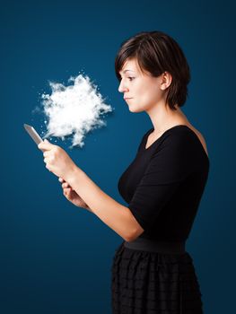 Young business woman looking at modern tablet with abstract cloud