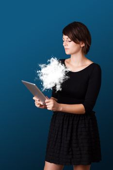 Young business woman looking at modern tablet with abstract cloud