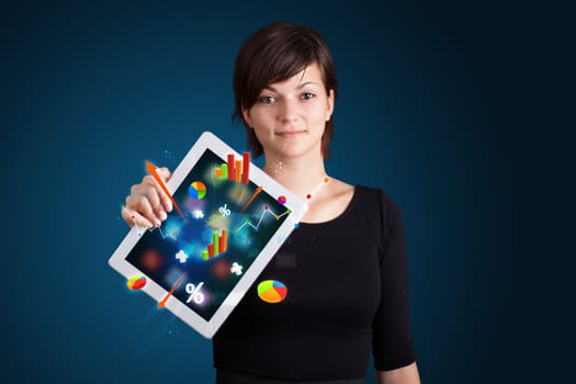 beutiful woman holding modern tablet with colorful diagrams and graphs