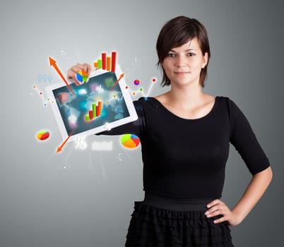 beutiful woman holding modern tablet with colorful diagrams and graphs