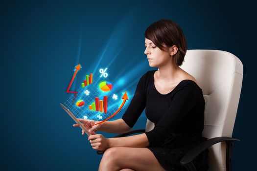 Young business woman looking at modern tablet with abstract lights and various diagrams