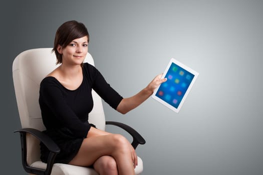 beautiful woman holding modern tablet with colorful icons