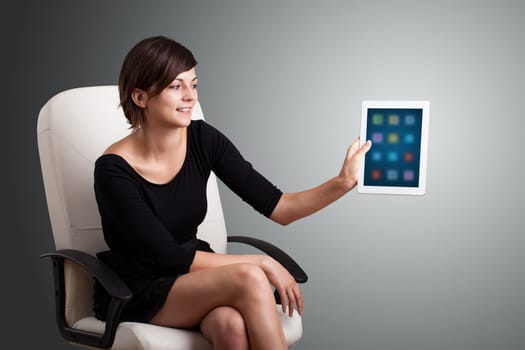 beautiful woman holding modern tablet with colorful icons