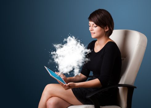 Young business woman looking at modern tablet with abstract cloud