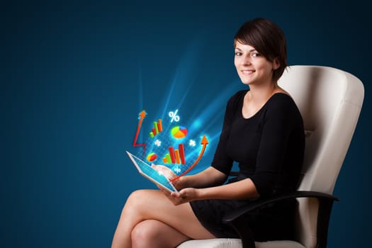 Young business woman looking at modern tablet with abstract lights and various diagrams