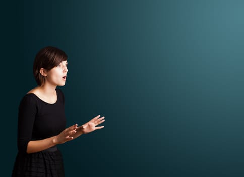 Beautiful young woman making gestures 
