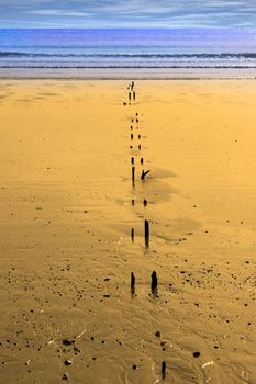 sunshine over the beach breakers in Youghal county Cork Ireland on a summers day