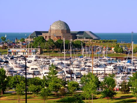 Chicago, USA - June 07, 2005: Adler Planetarium & Astronomy Museum with Burnham Harbor in the foreground.  The Adler Planetarium opened in the year 1930.