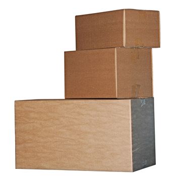 Brown cardboard boxes arranged in stack on white background 