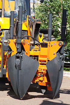 heavy duty construction equipment parked at worksite 