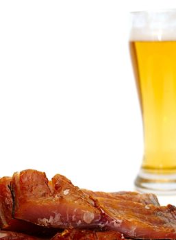 Smoked fish and cup of beer on a white background 