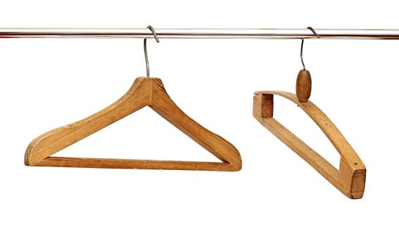 close up of cloth hangers in row on white background 