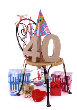Number of age in a colorful studio setting with paper party hat and figures, a red heart and gifts