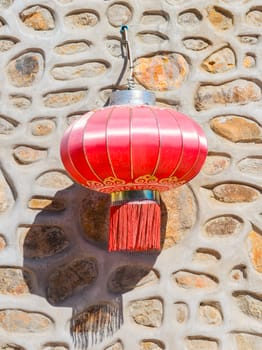 traditional red chinese lantern hanging on the wall