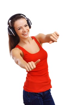 Happy smiling girl dancing and listening to music