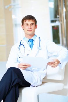 Portrait of friendly male doctor in hospital smiling