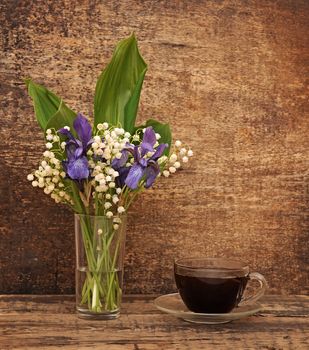 Still-life bouquet of lily of the valley  with blue irises