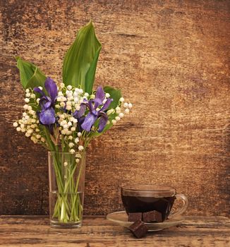 Still-life bouquet of lily of the valley  with blue irises