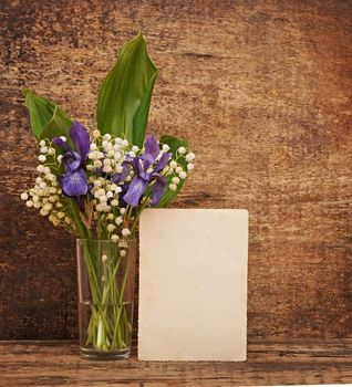 Still-life bouquet of lily of the valley  with blue irises