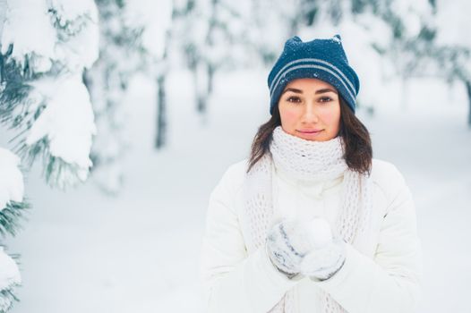 Portrait of beautiful young girl in winter day
