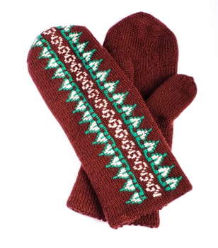 Brown woolen knitted mittens on white background