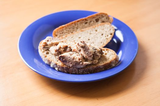 Sardines on bread on a plate ready to eat