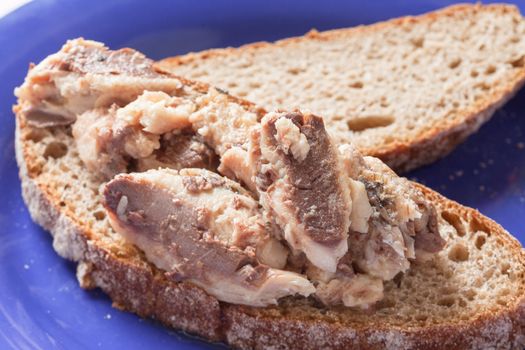 Sardines on bread on a plate ready to eat