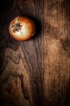 onion on textured brown wood