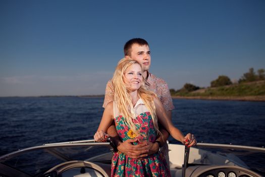 young happy couple on the boat