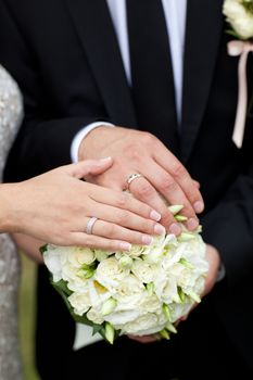 bouquet and wedding rings of bride and groom