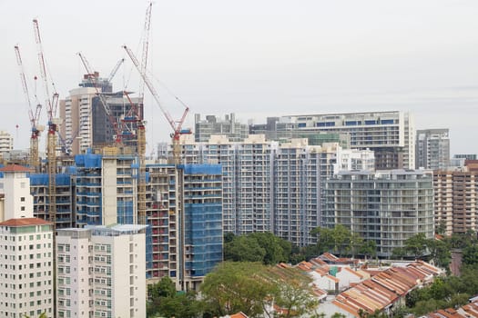 Condominiums Building Construction with Multiple Cranes in Asian City