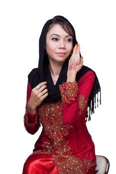 Beautiful muslim lady wear red with hijab, henna painted on hand