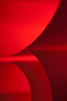 Red paper hard edge shapes abstract closeup