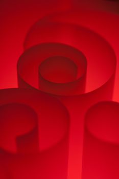 Blank red design paper curled up with soft light