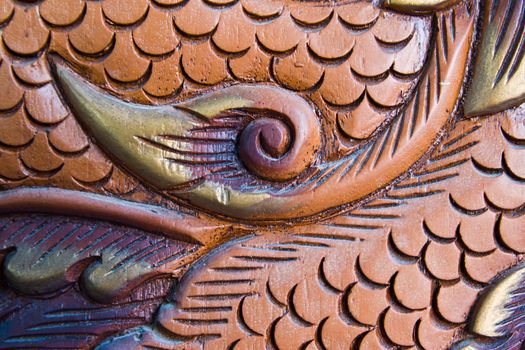 wood carving of a dragon at thailand