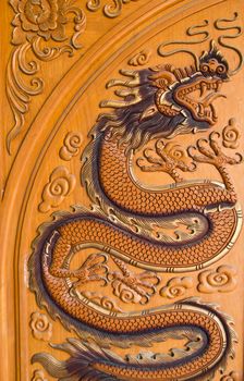 wood carving of a dragon at thailand