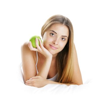 Young Woman Holding Apple in Bed